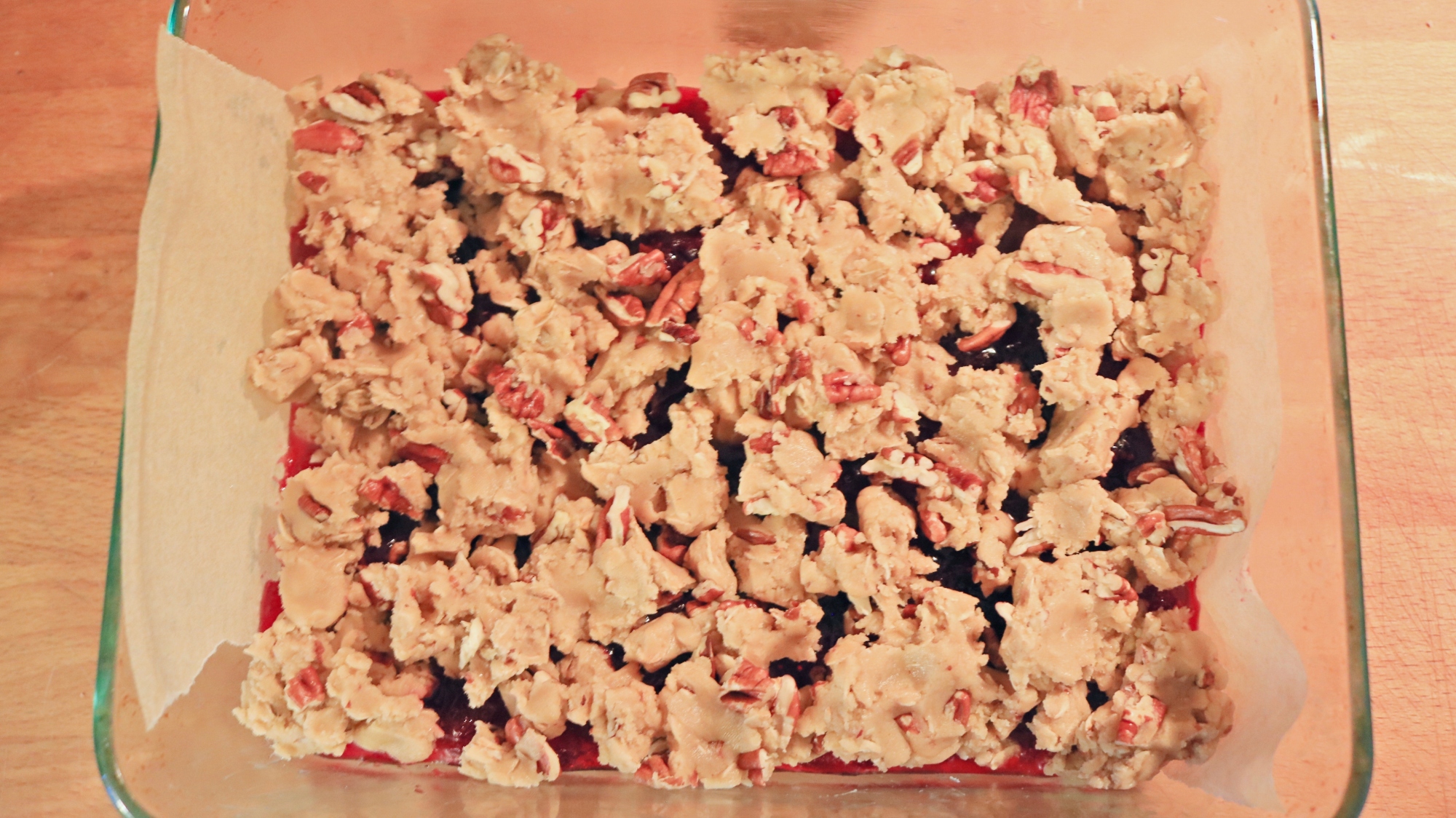 Crumble topping on jam bars.