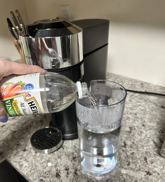 Adding vinegar to a Nespresso reservoir to descale it