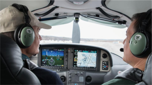 An image of two pilots in a small aircraft