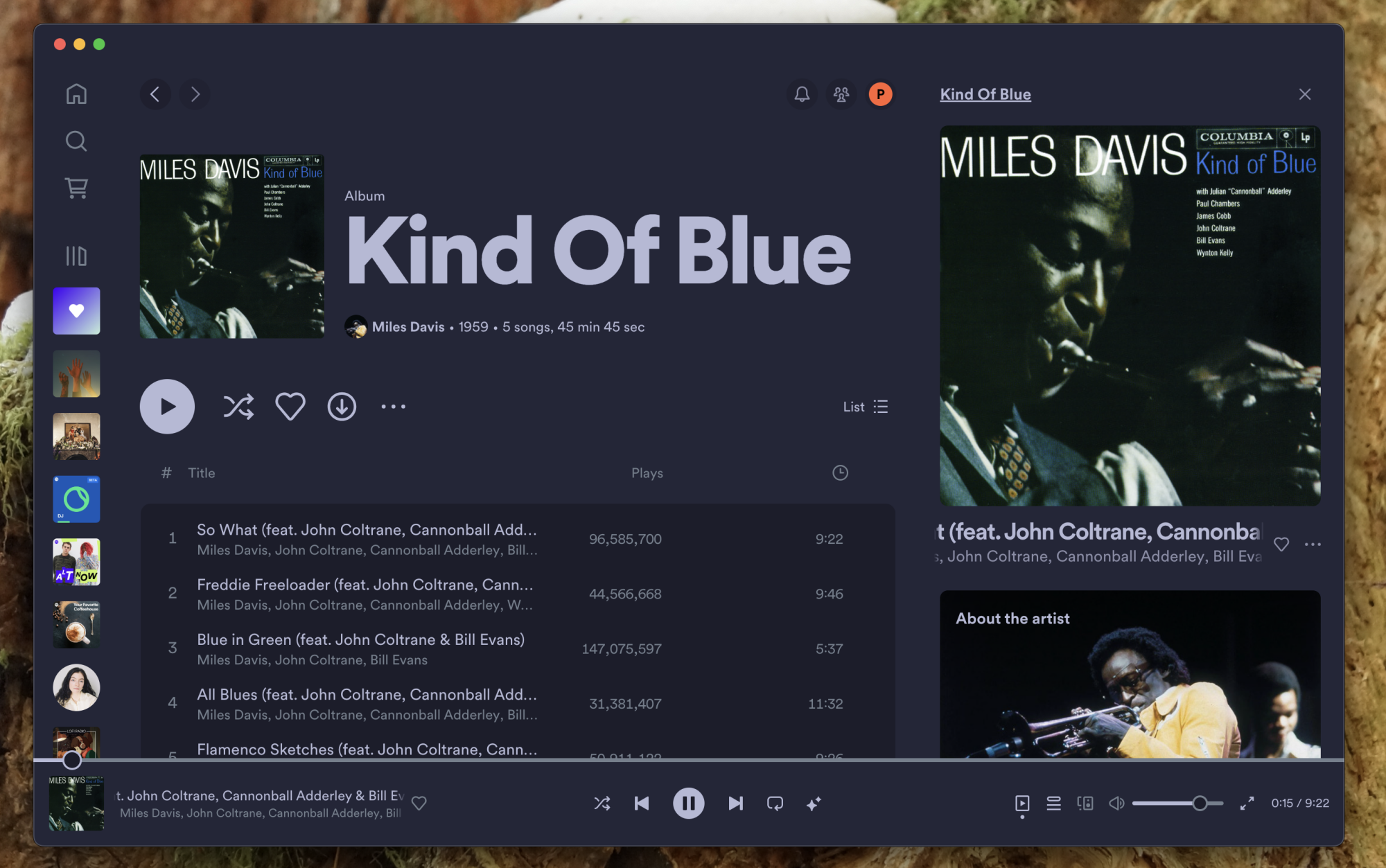 A screenshot of Spotify with a blue theme playing "Kind of Blue" by Miles Davis