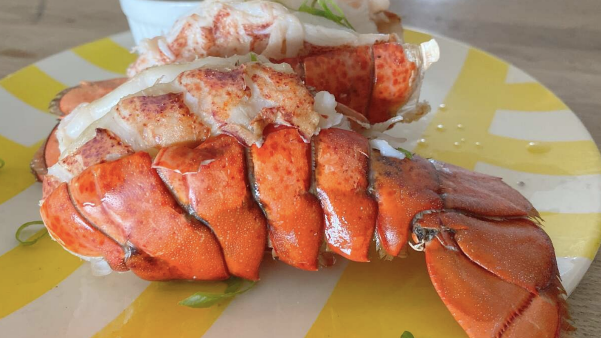 Lobster tail on a plate.