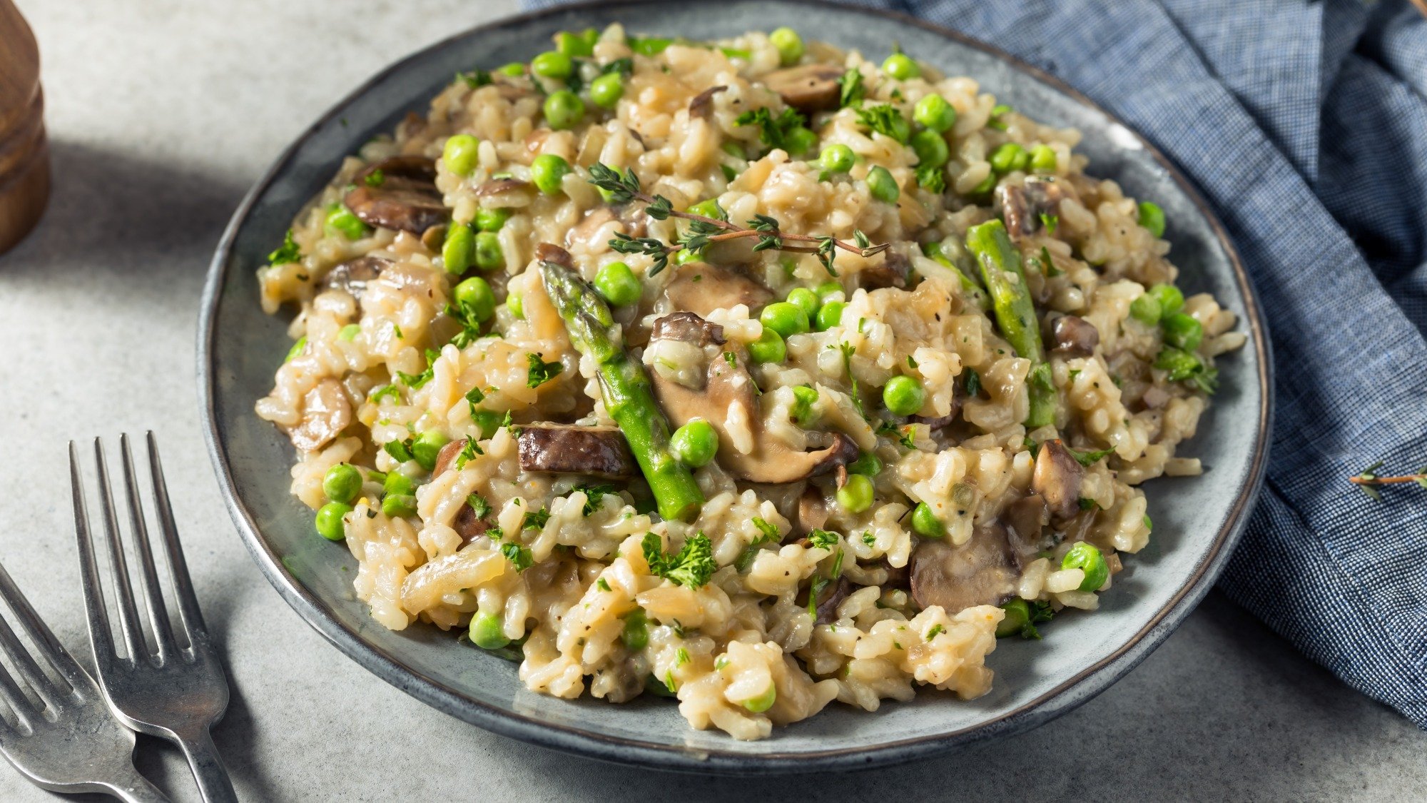 Asparagus and mushroom risotto in a bowl.